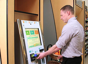 A customer purchases items from our self-checkout kiosk