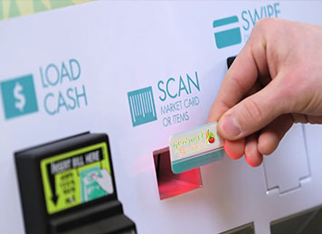 A customer scans his micro-market card